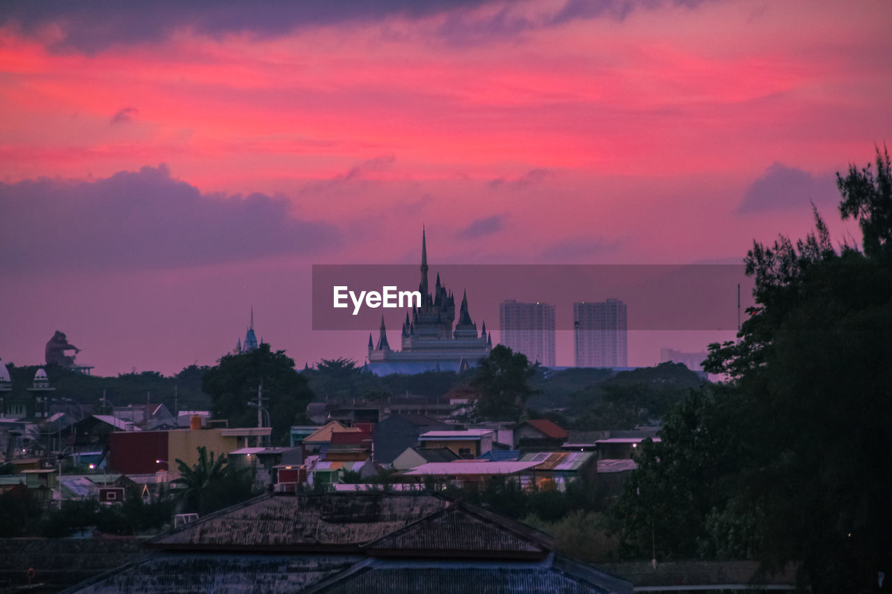 VIEW OF BUILDINGS AGAINST SKY DURING SUNSET