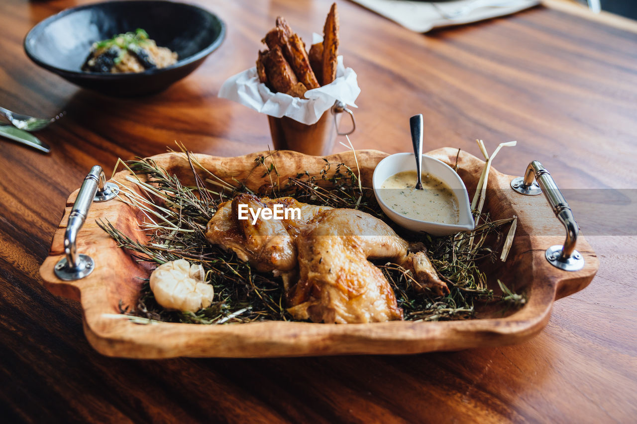 Chicken meat in tray on table