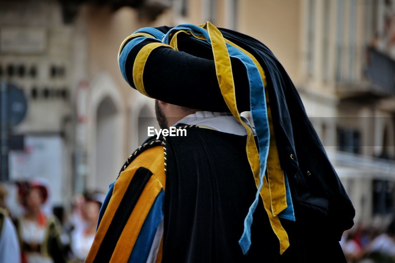 Rear view of man wearing traditional clothing during festival