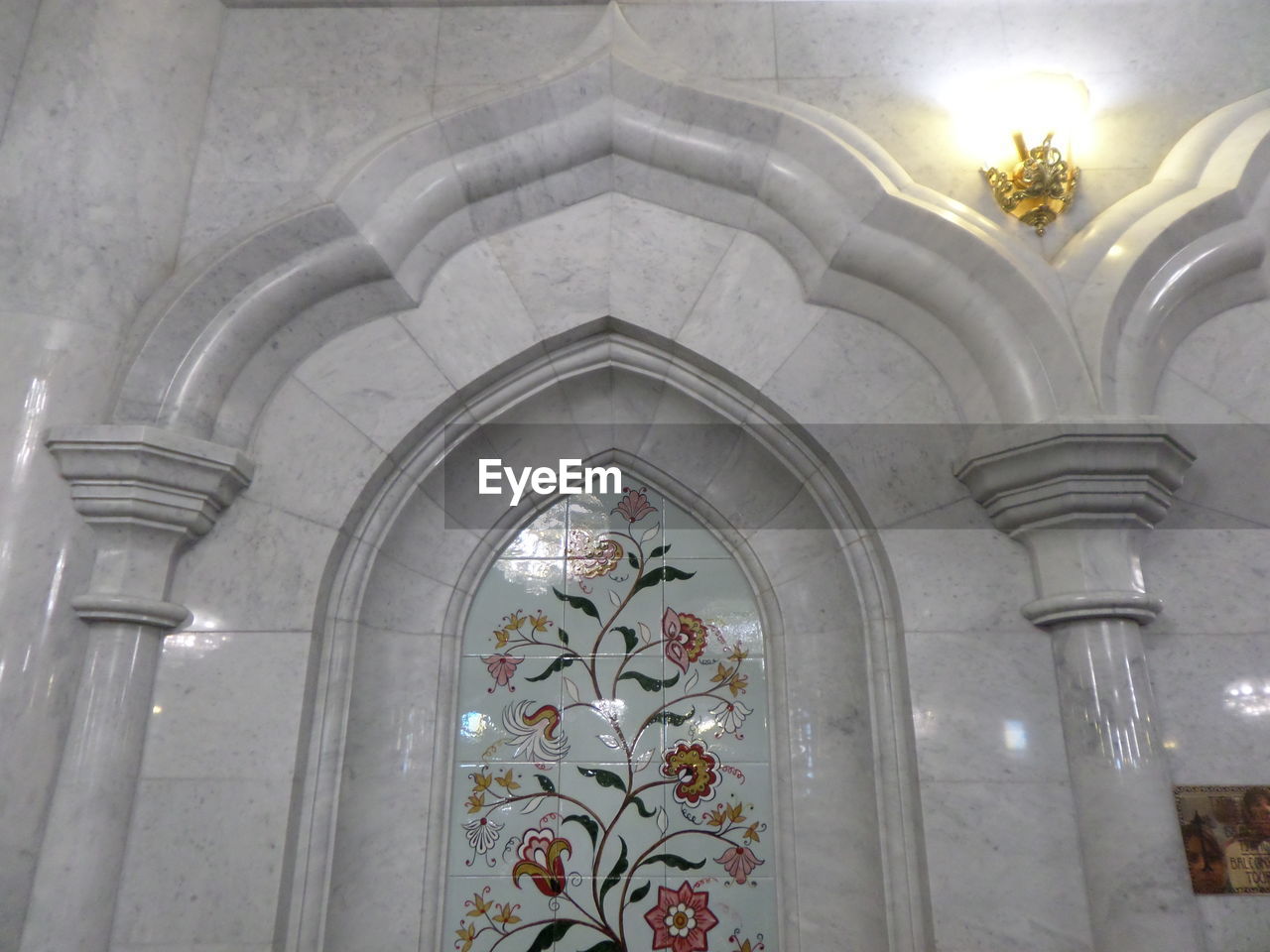 LOW ANGLE VIEW OF ILLUMINATED CHANDELIER