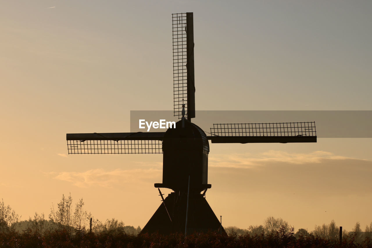 sky, windmill, renewable energy, power generation, environmental conservation, nature, alternative energy, environment, mill, sunset, turbine, wind turbine, wind power, landscape, rural scene, no people, field, technology, silhouette, outdoors, traditional windmill, machine, land, plant, architecture, agriculture