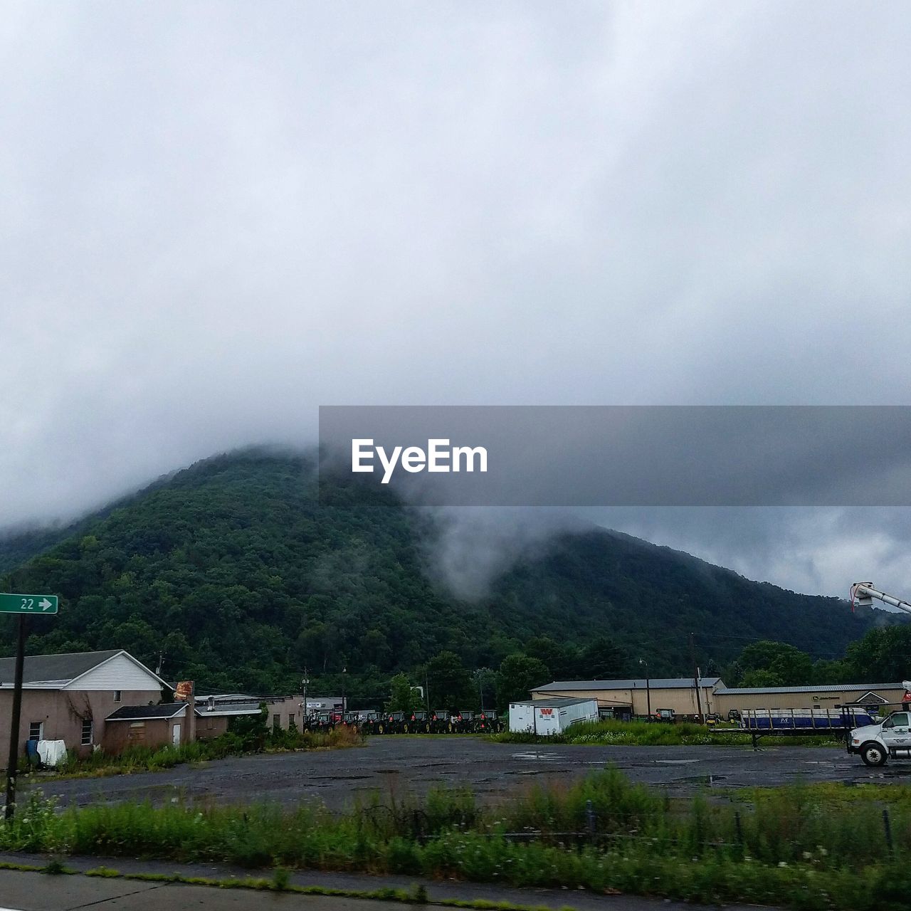 Scenic view of mountains against cloudy sky