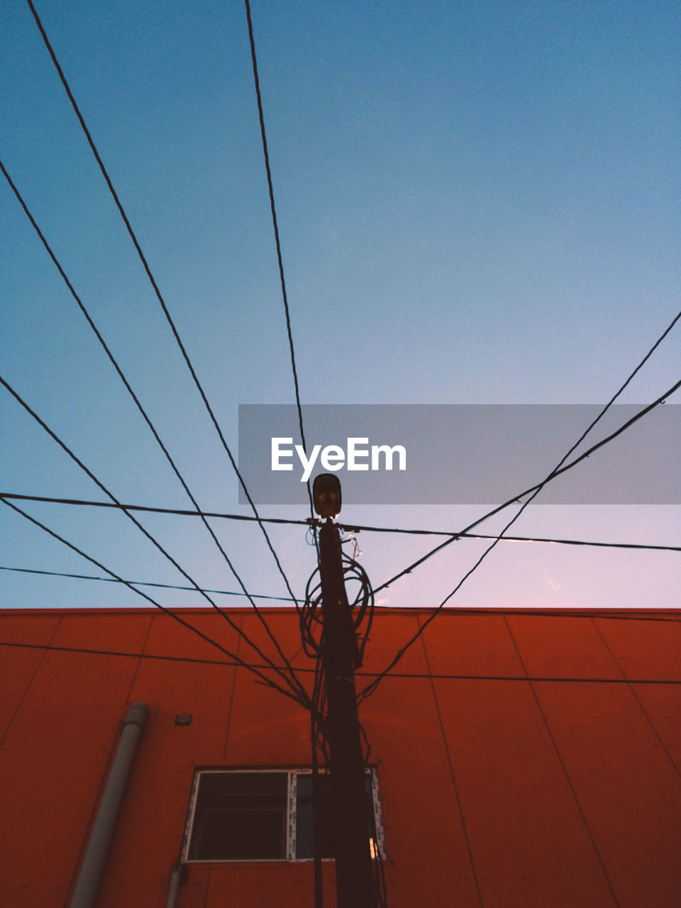 Low angle view of cables against clear sky