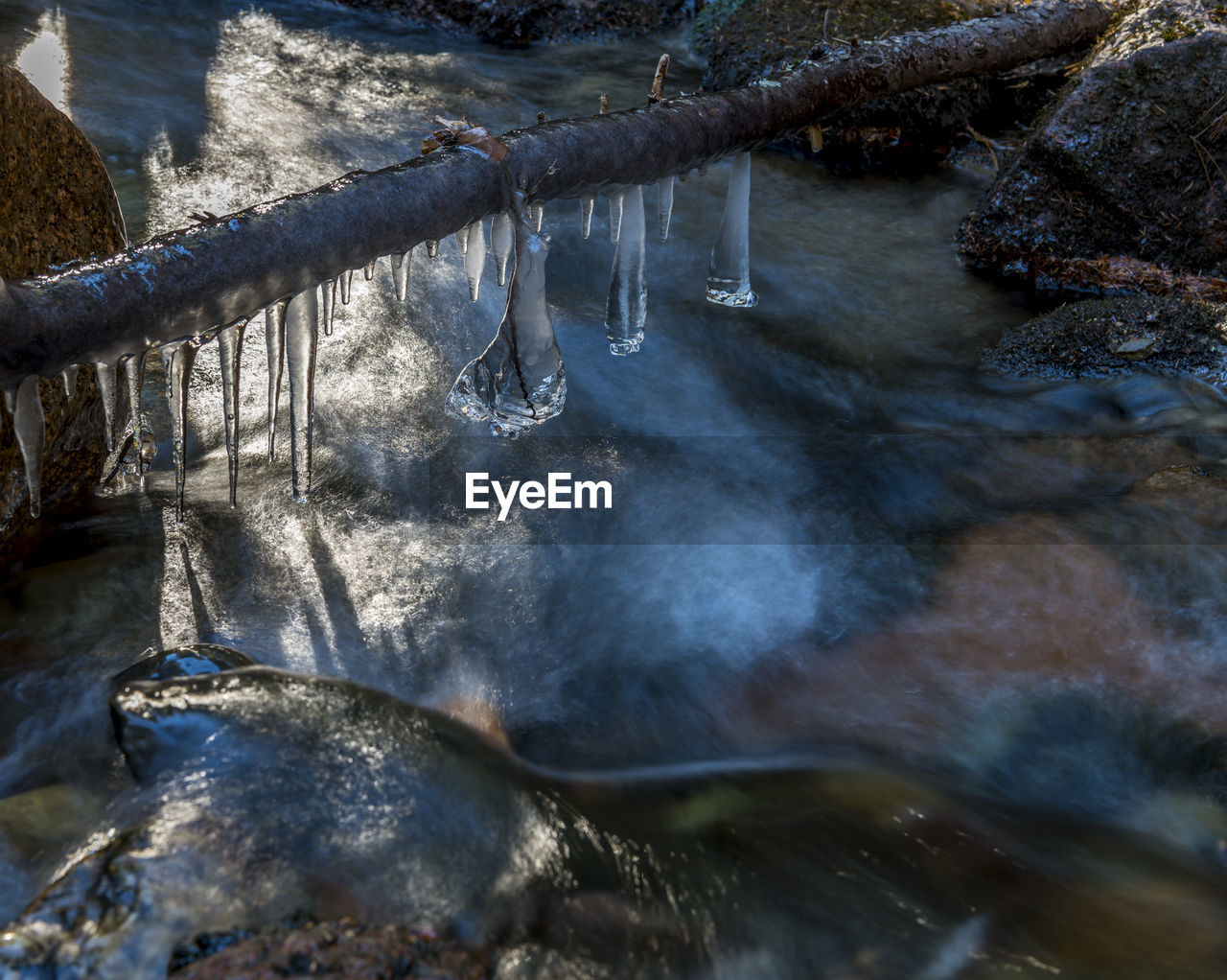 SCENIC VIEW OF FROZEN LAKE DURING WINTER