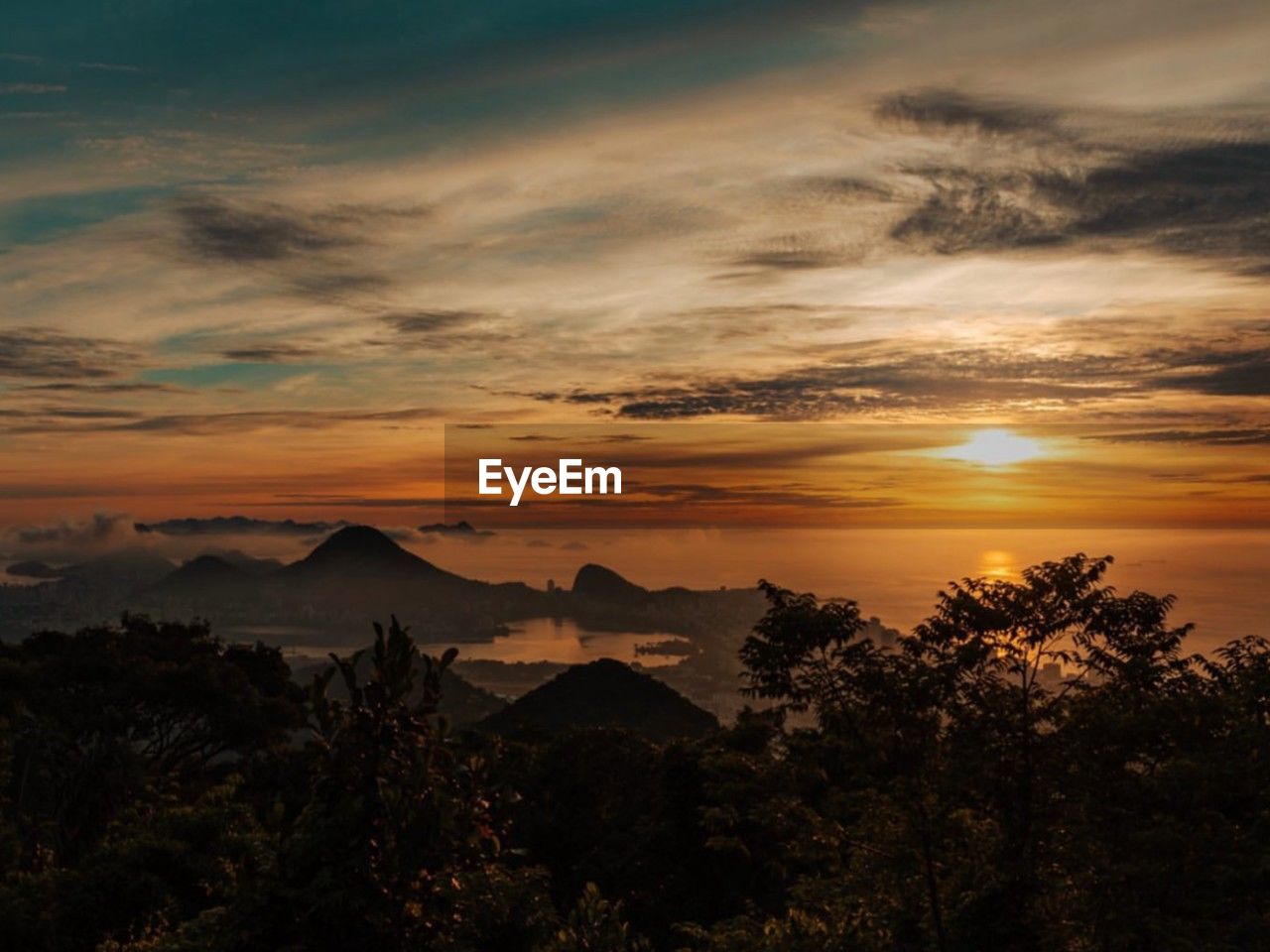 scenic view of mountains against sky during sunset