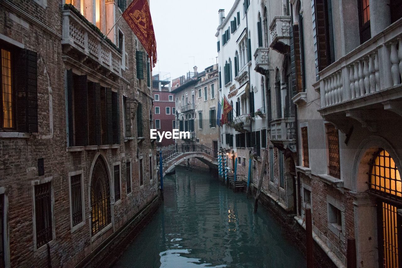 Canal amidst buildings