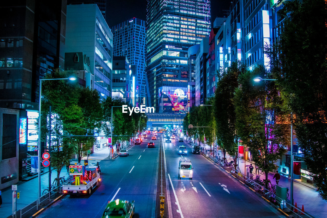 High angle view of illuminated city street at night