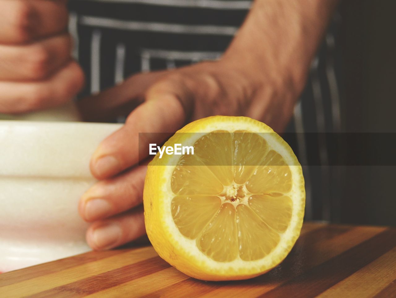 Cropped image of person working in kitchen