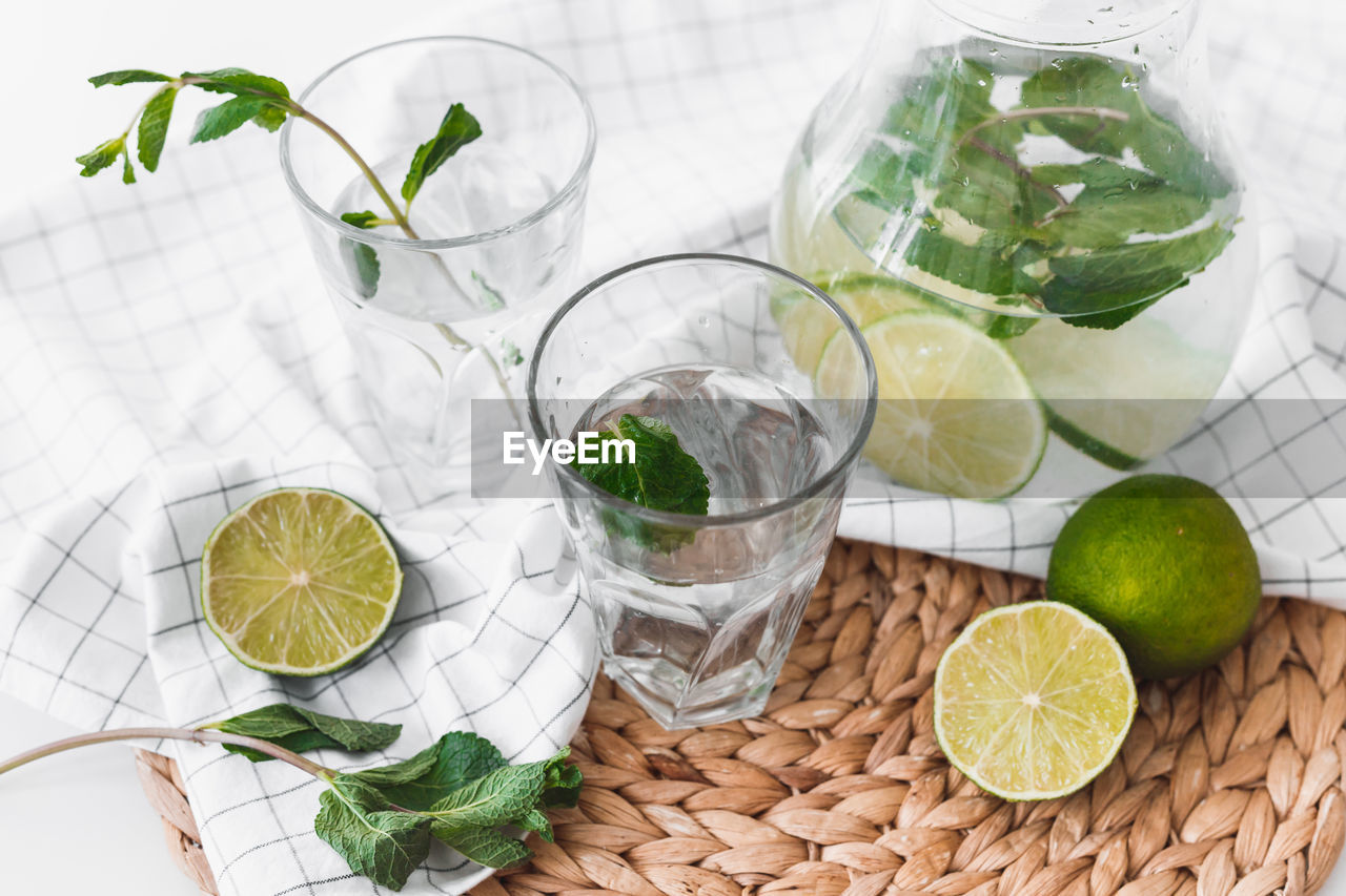 GREEN FRUITS AND GLASS OF TABLE