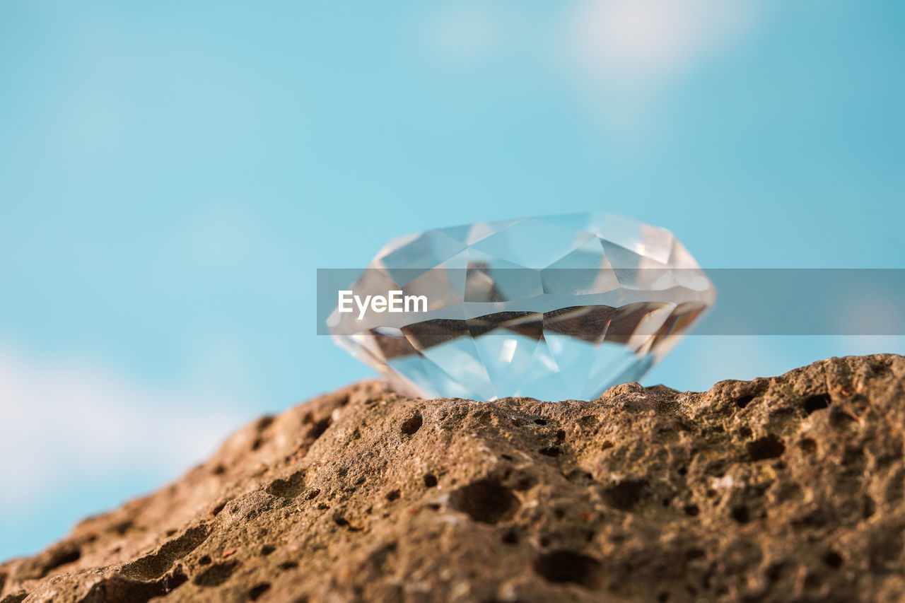 blue, rock, nature, no people, macro photography, jewelry, sky, close-up, outdoors, diamond, copy space, day, gemstone