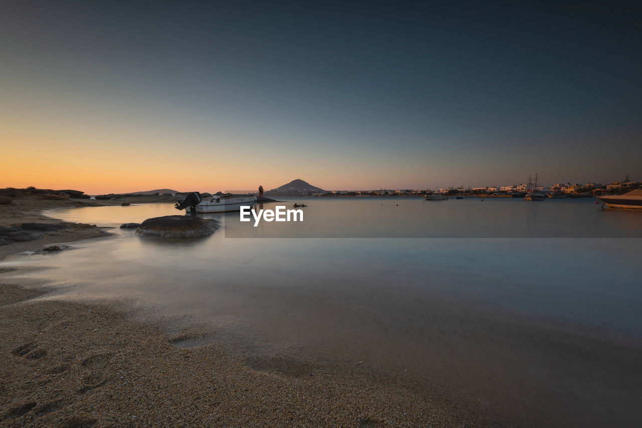 Scenic view of sea against clear sky during sunset