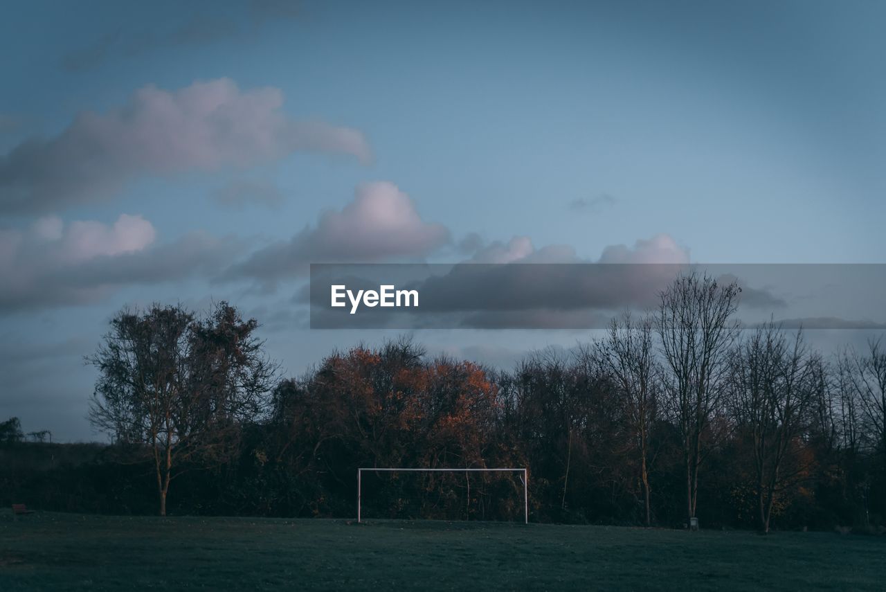 Football soccer goal against trees and blue sky