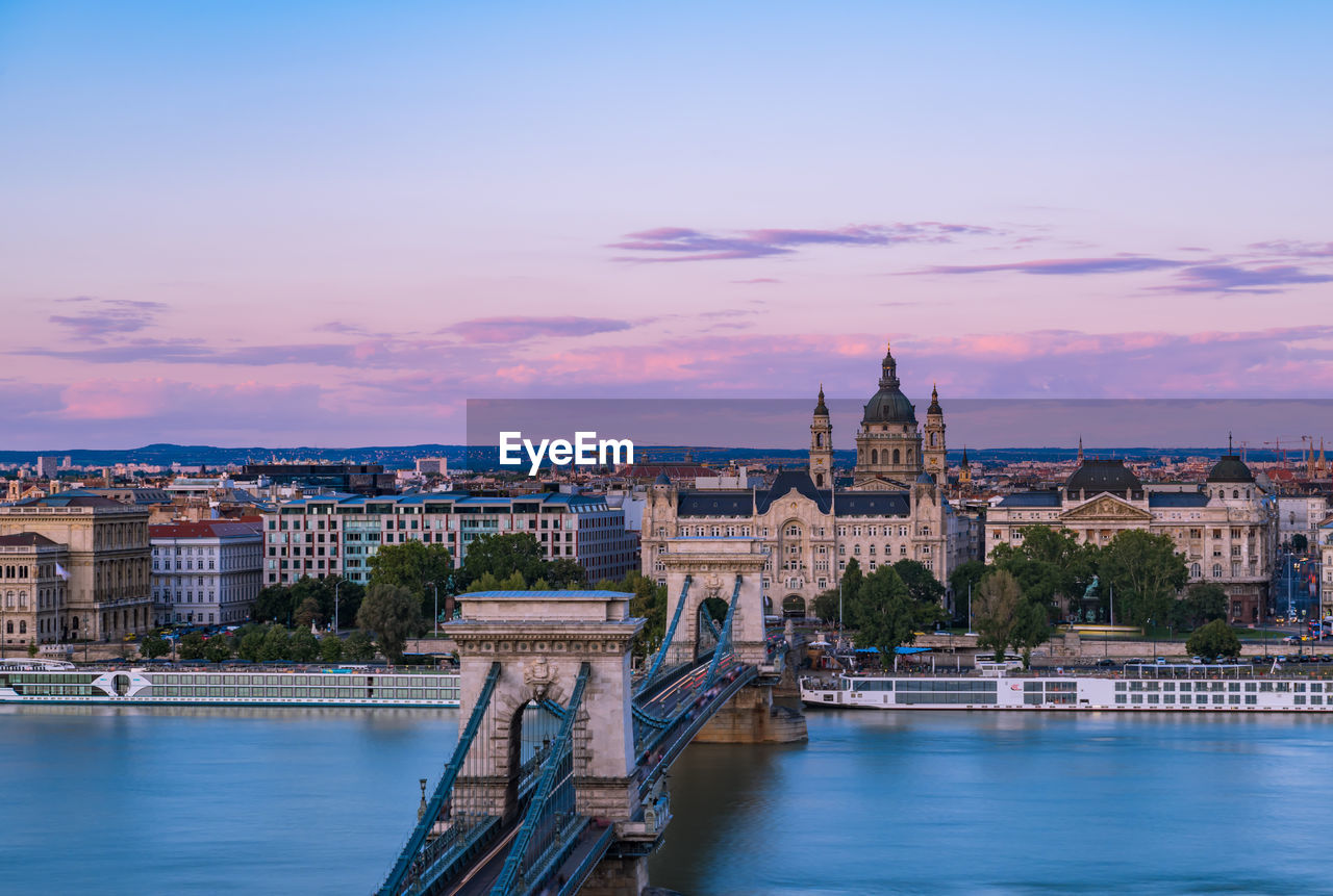 High angle view of chain bridge and city buildings