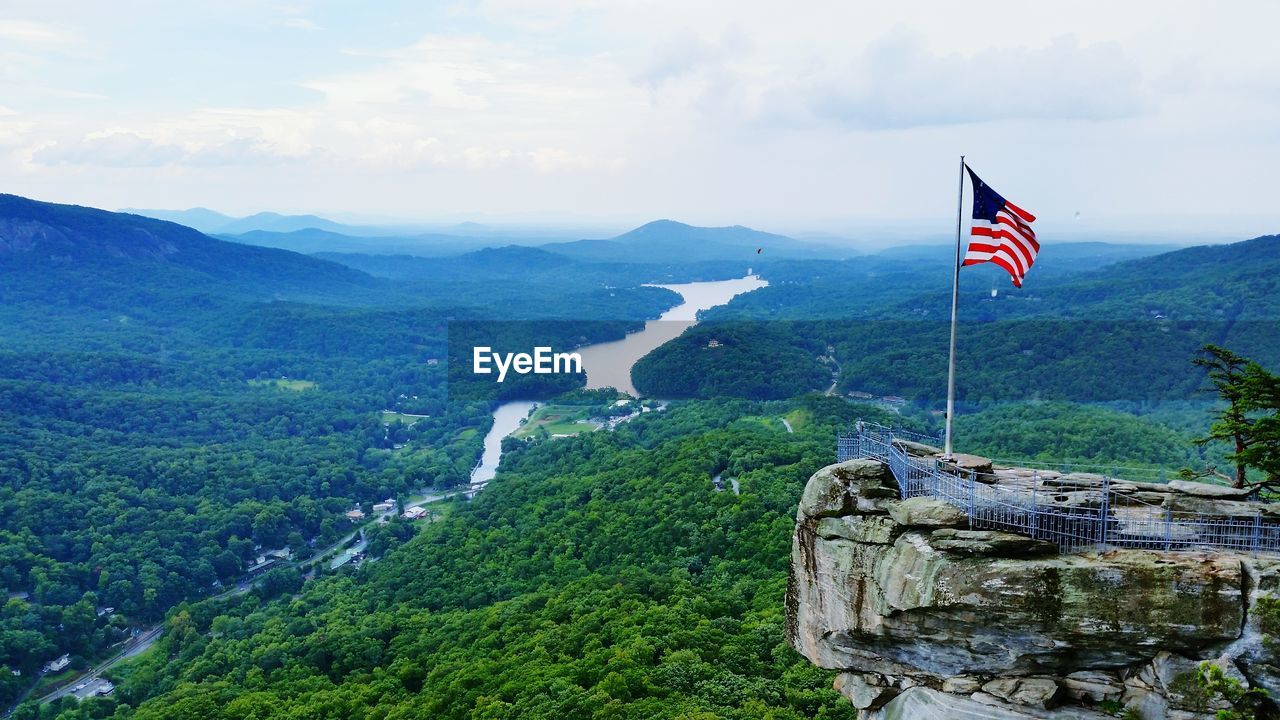 American flag on chimney rock against sky