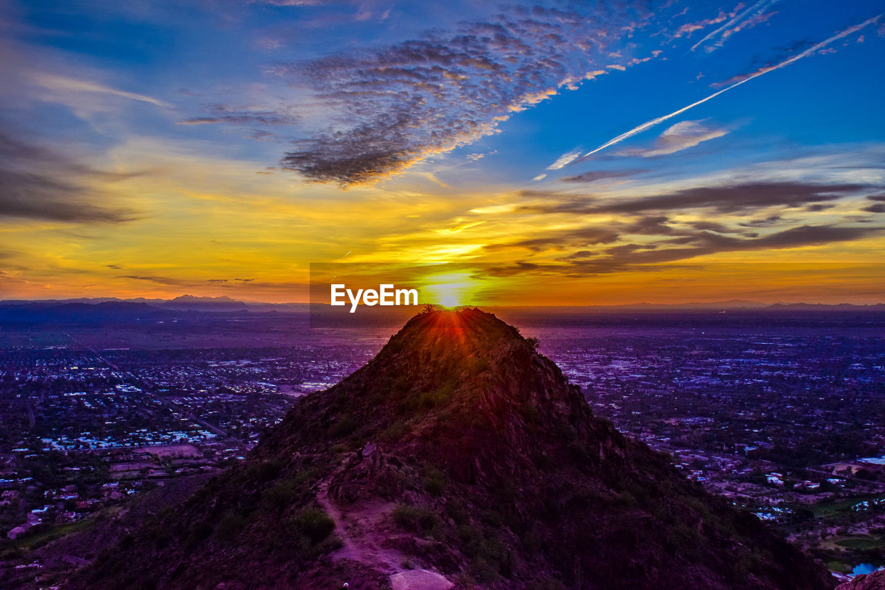 SCENIC VIEW OF SUNSET OVER MOUNTAIN