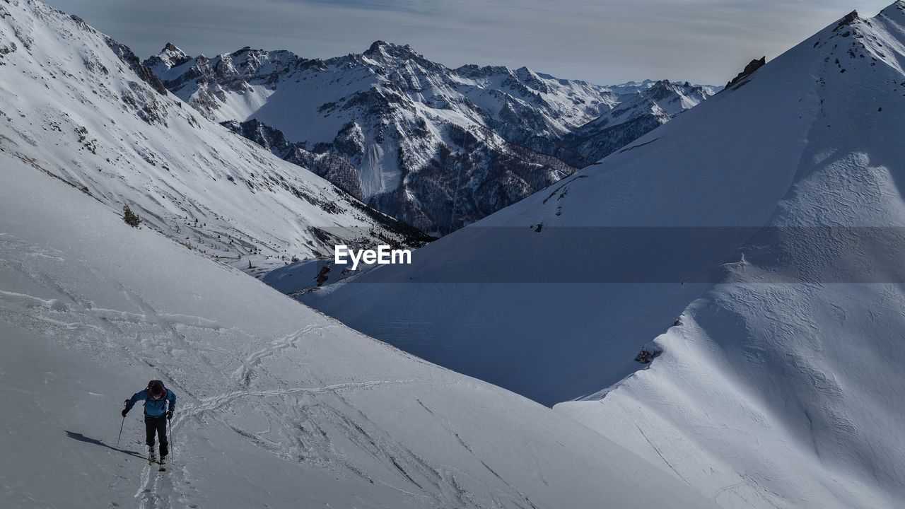 High angle view of man skiing on snowcapped mountain