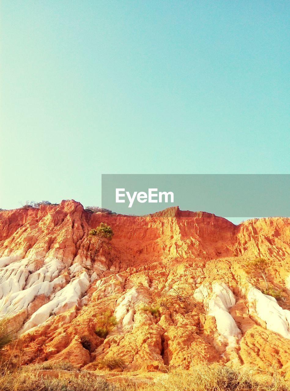 MOUNTAIN AGAINST CLEAR SKY