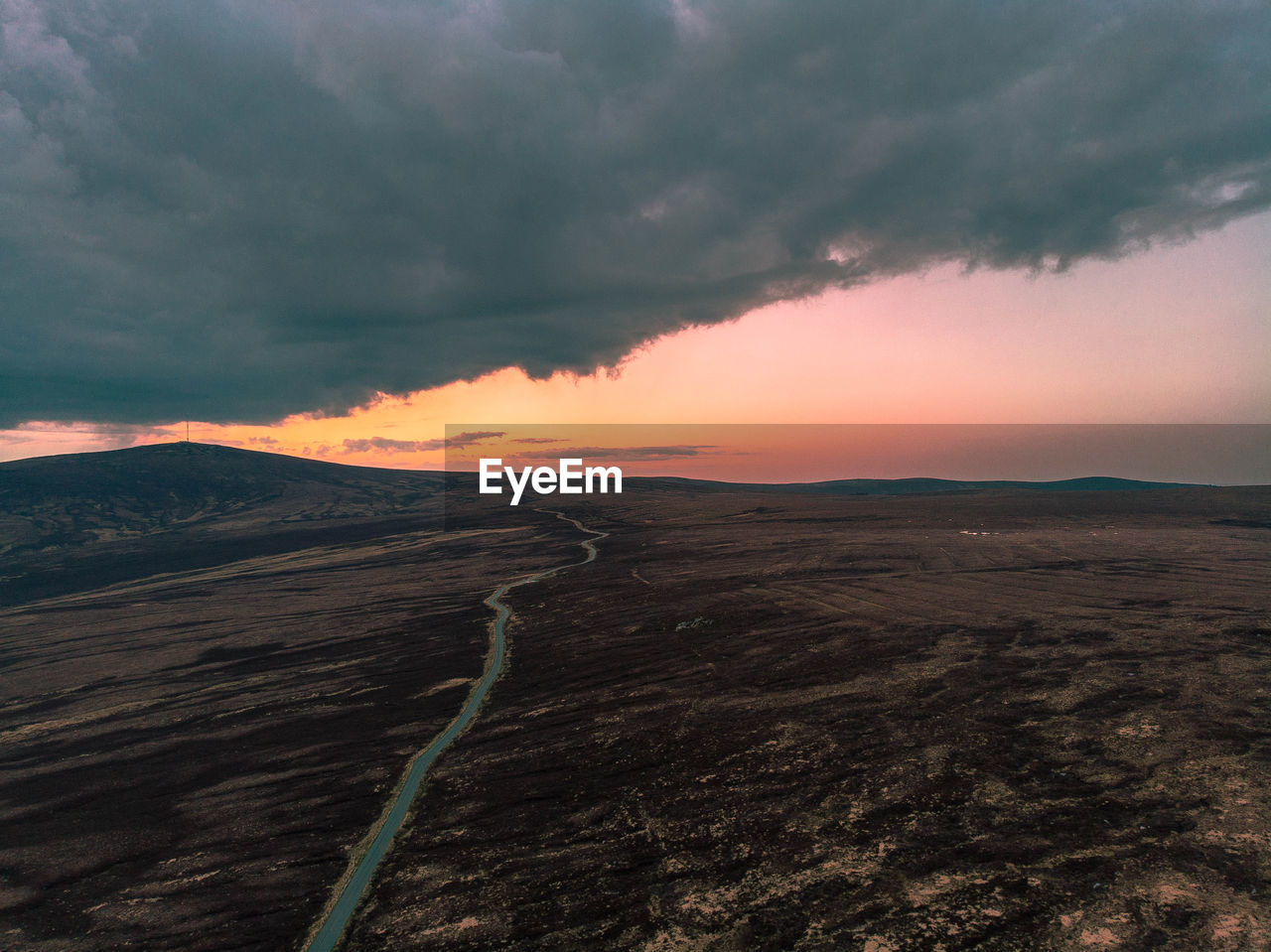 Scenic view of landscape against sky during sunset