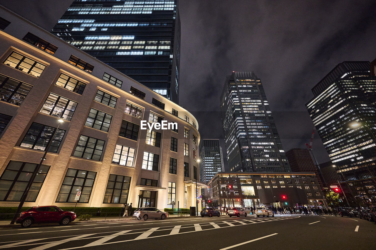 Buildings in city at night