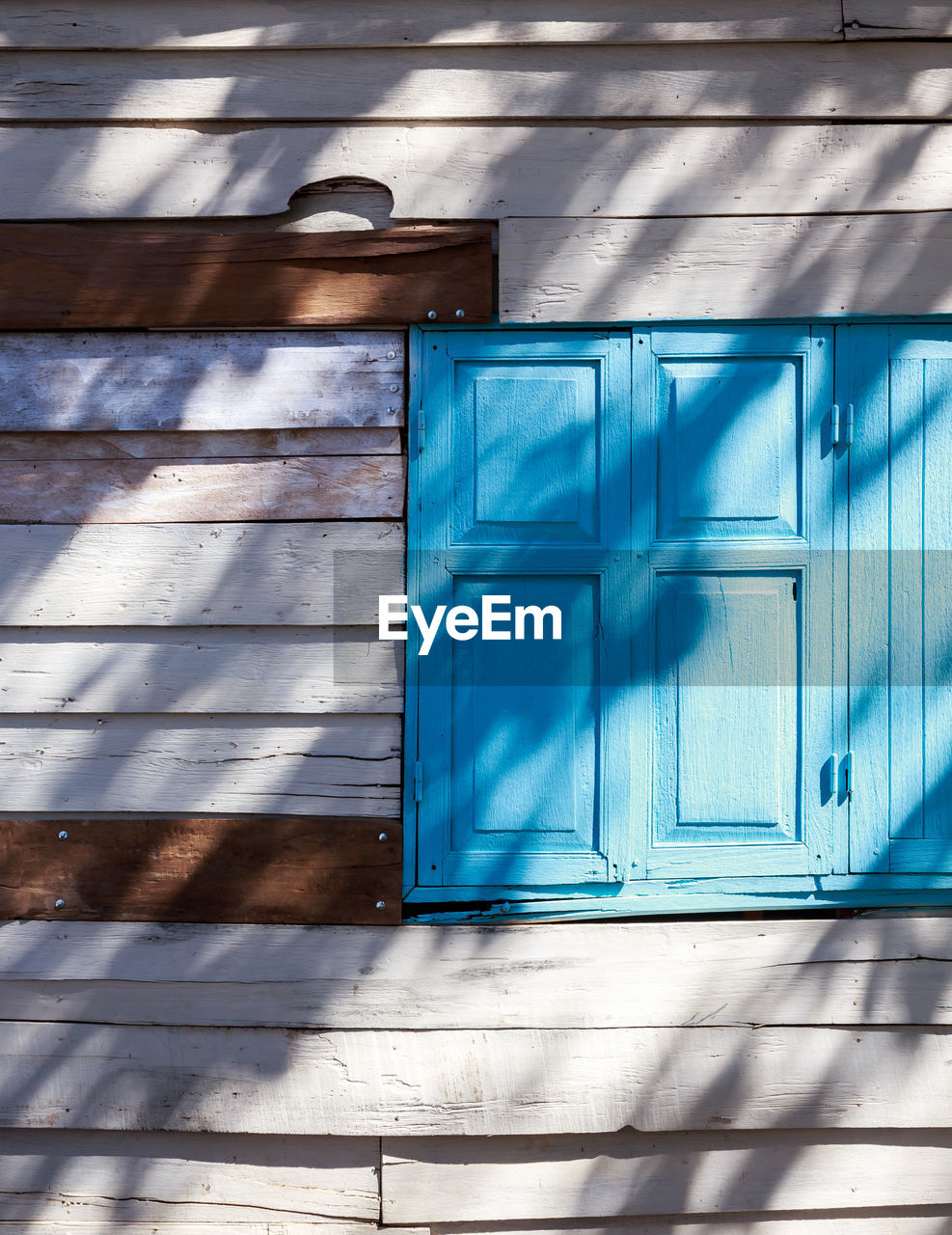 Closed window of wooden house