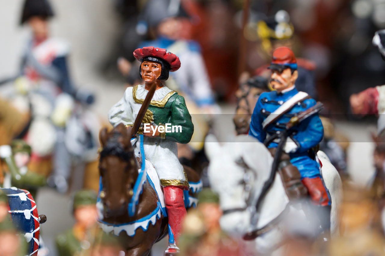 Close-up of figurines against blurred background