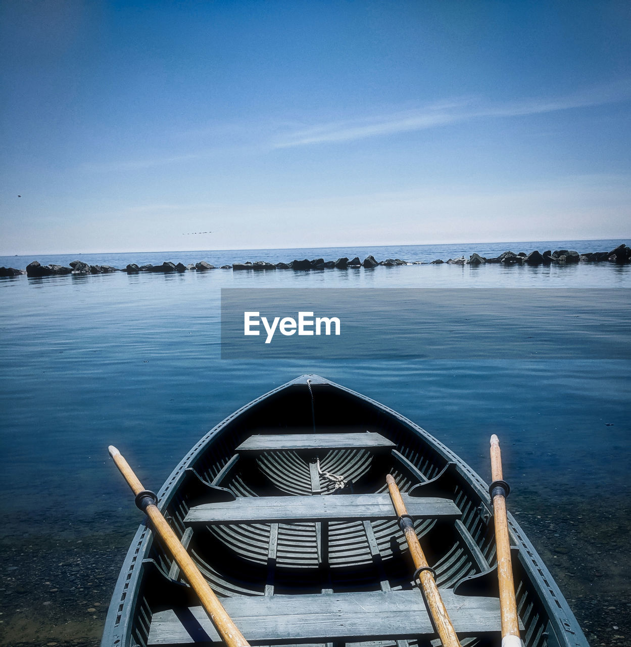 Scenic view of sea against blue sky