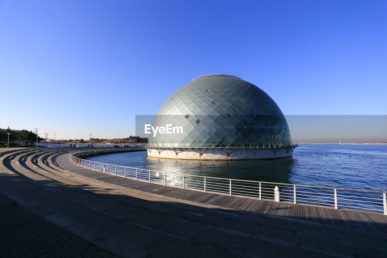 Scenic view of sea against clear blue sky