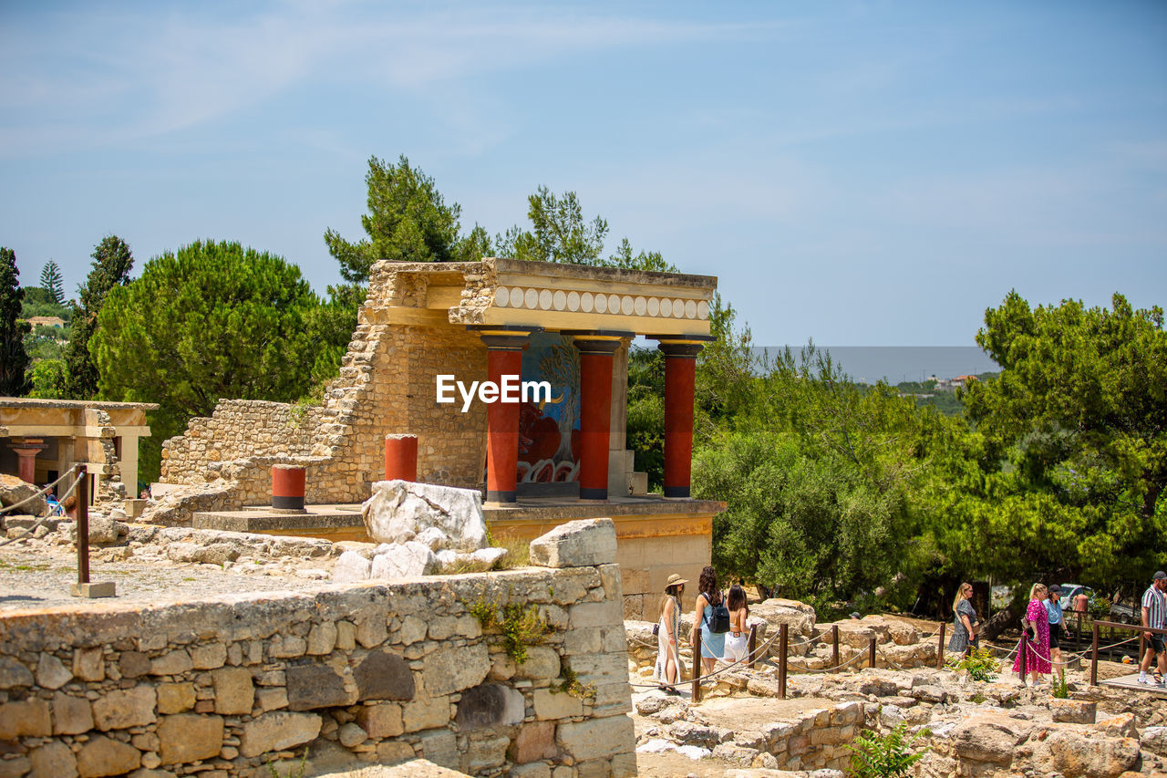 architecture, history, built structure, the past, tree, travel destinations, sky, plant, group of people, travel, nature, vacation, ancient, tourism, building exterior, ancient history, religion, temple - building, temple, belief, tourist, day, men, building, outdoors, city, spirituality, large group of people, ruins, cloud, crowd, adult, stone material, place of worship, tradition, ancient civilization, old ruin