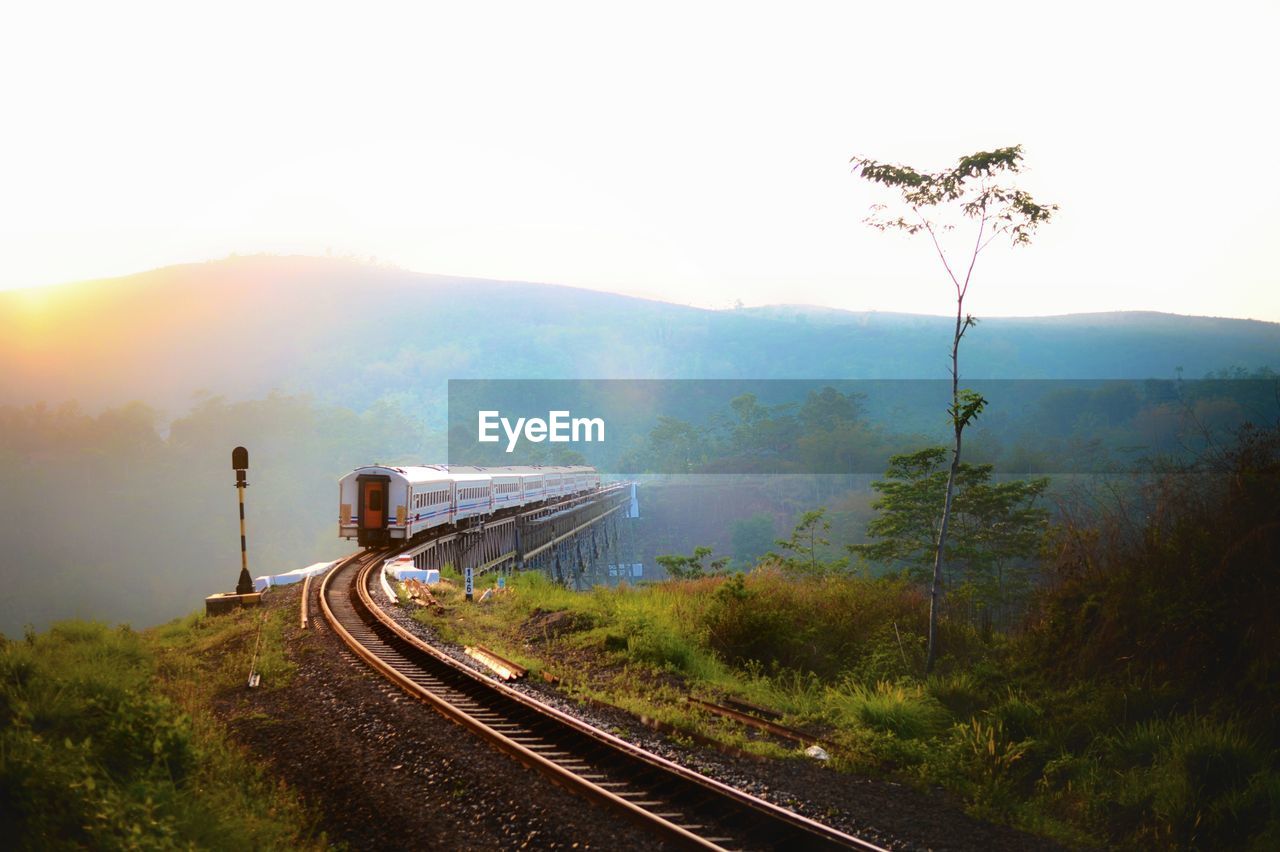 Train on railroad track against sky