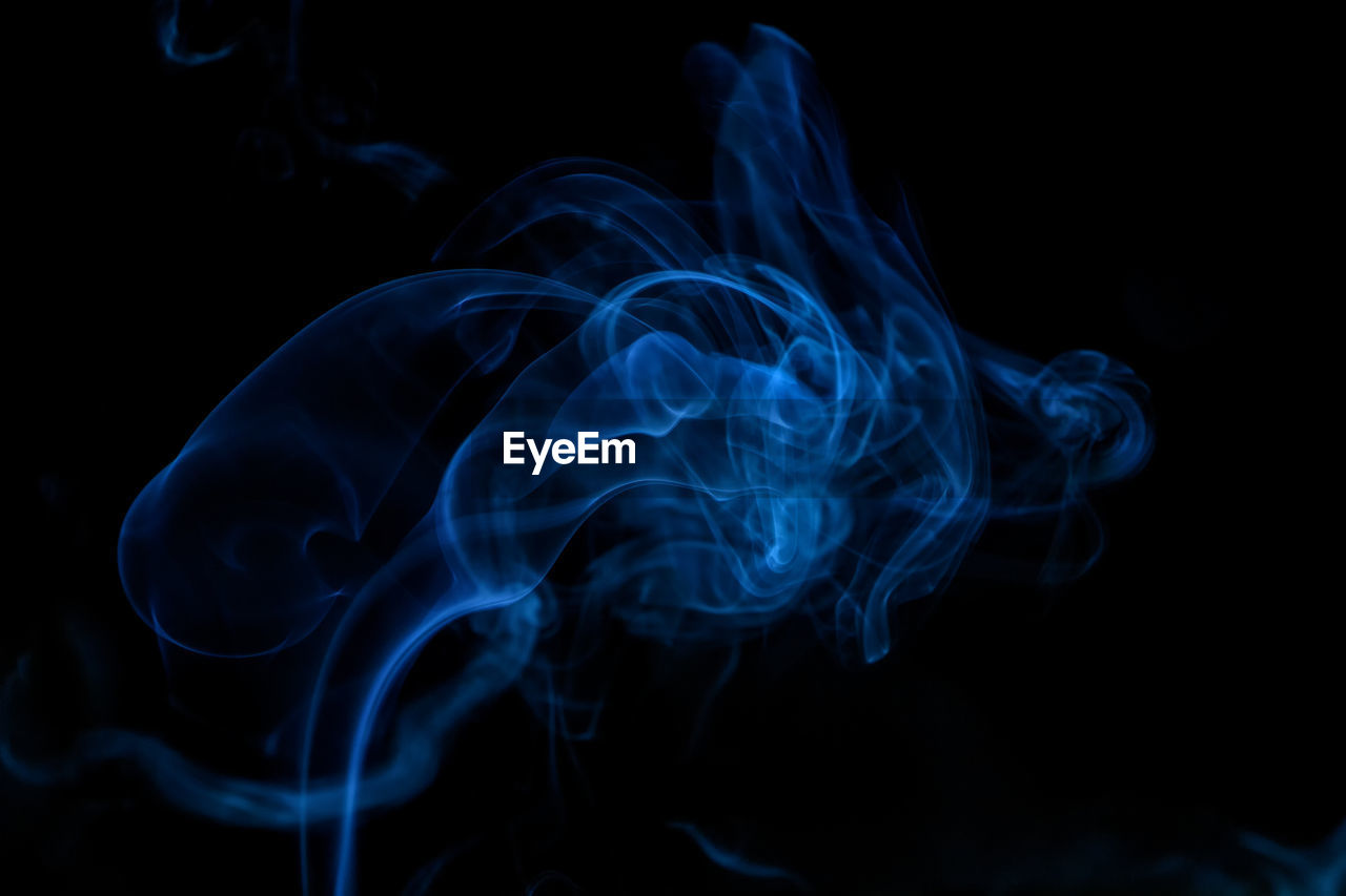 Close-up of smoke against black background