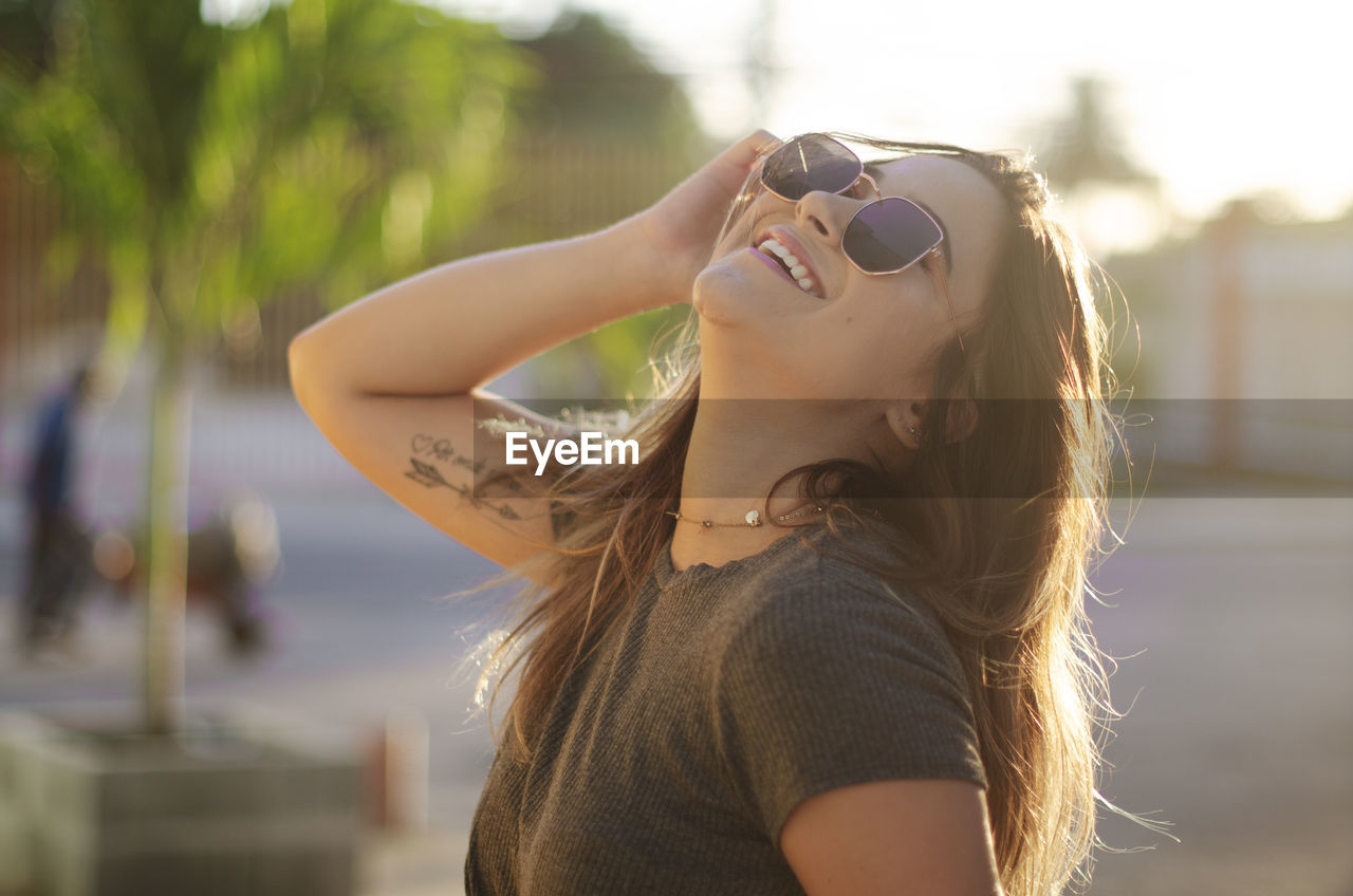 Portrait of young woman wearing sunglasses