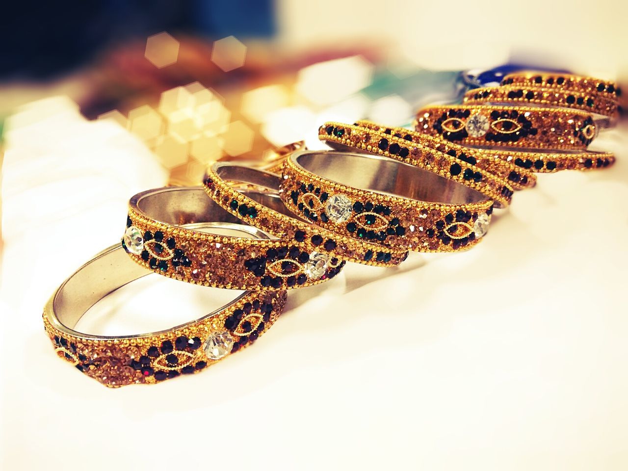 Close-up of patterned bangles on table