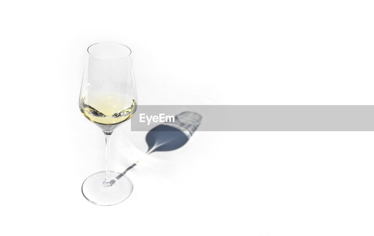 close-up of drink in glass against white background