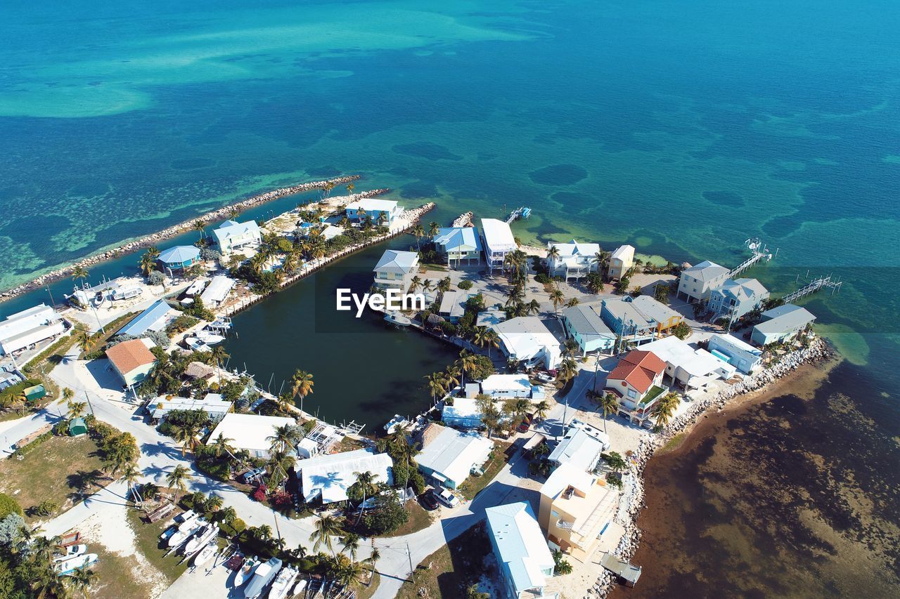 High angle view of buildings by sea