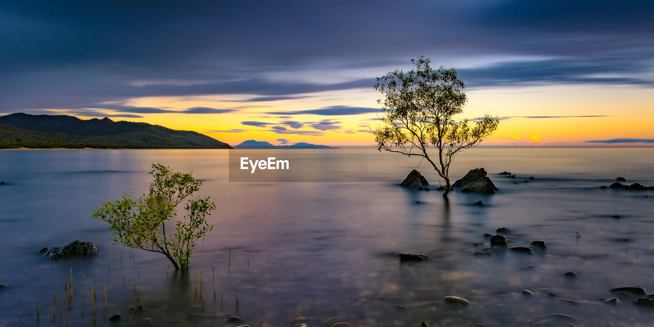 Scenic view of sea against sky at sunset