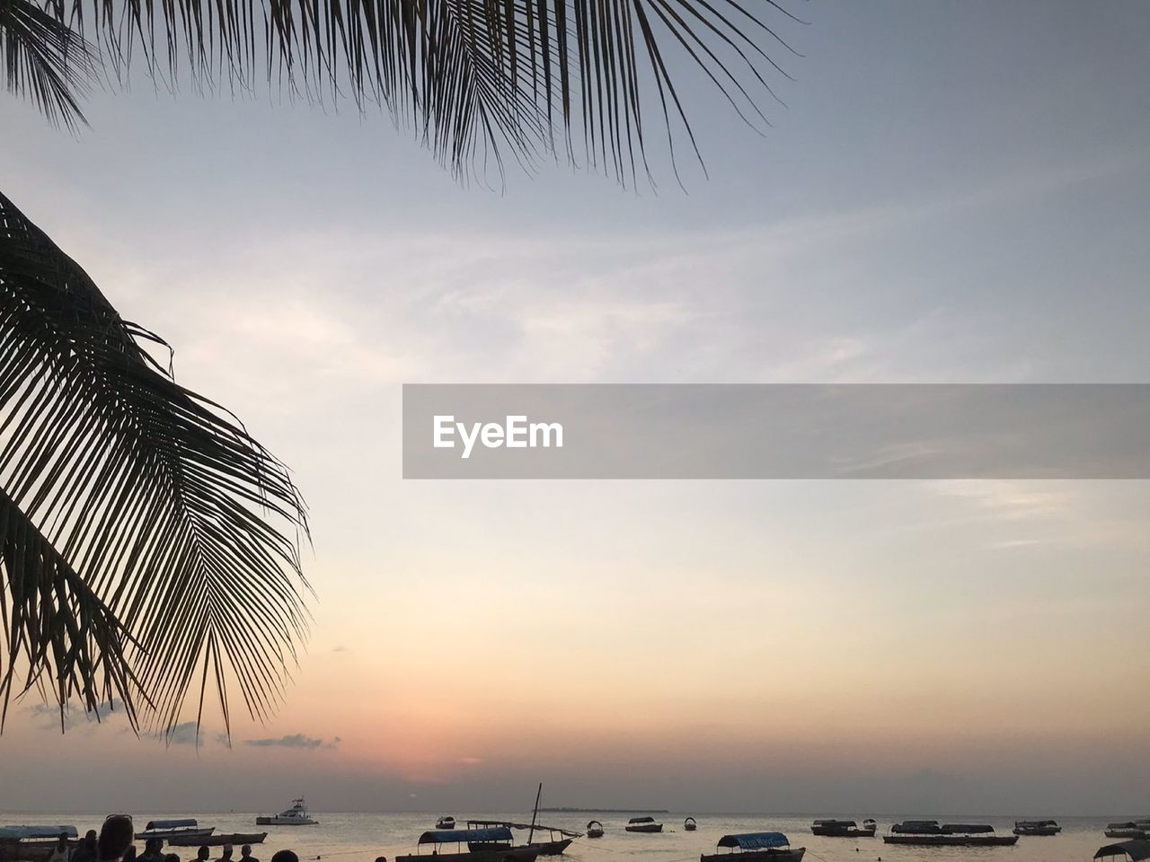 Scenic view of sea against sky at sunset