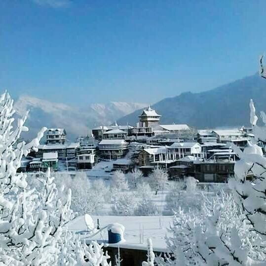 VIEW OF SNOW COVERED MOUNTAIN AGAINST CLOUDY SKY