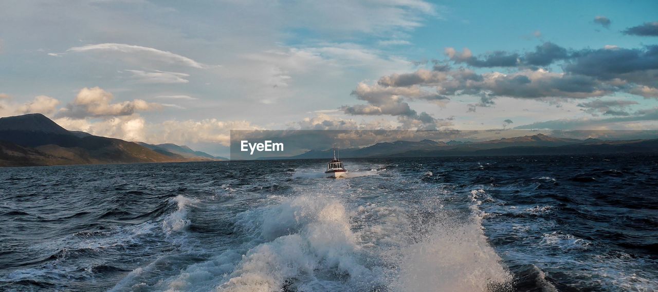 Scenic view of sea against cloudy sky