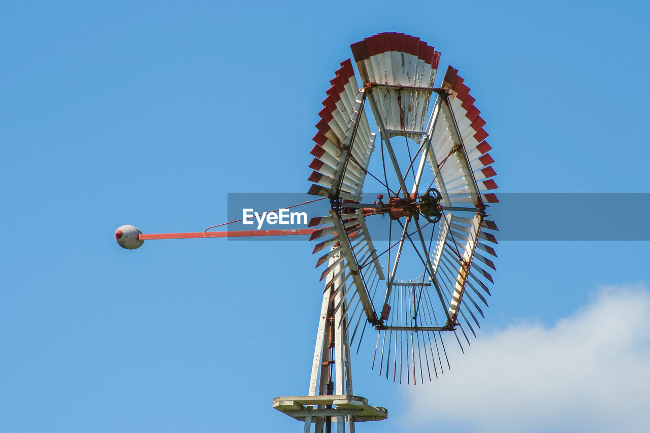 LOW ANGLE VIEW OF FERRIS WHEEL AGAINST SKY