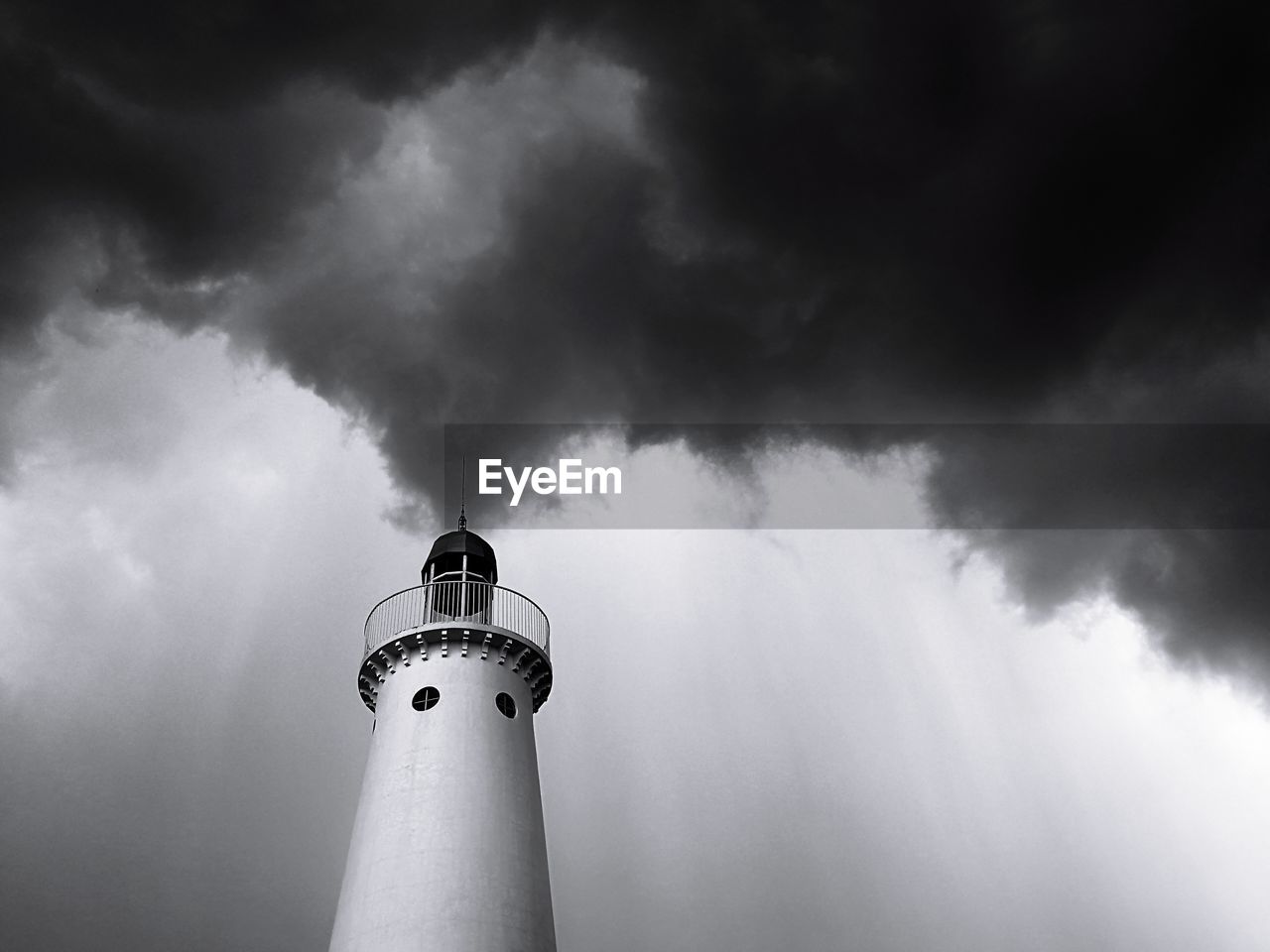 LOW ANGLE VIEW OF LIGHTHOUSE AGAINST CLOUDS