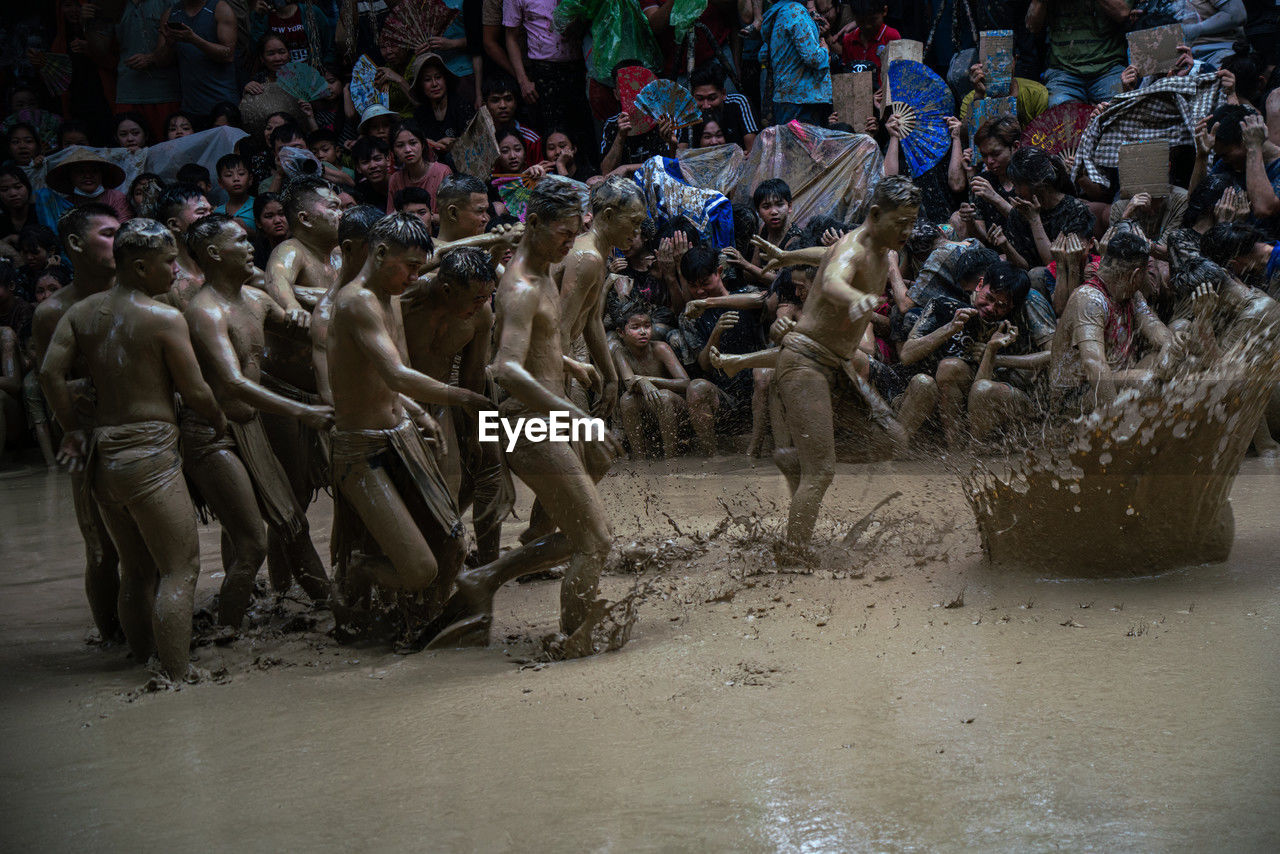 crowd, large group of people, group of people, mud, men, adult, outdoors