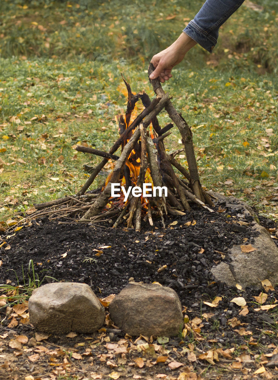 Prepare campfire, put a stick in the fire