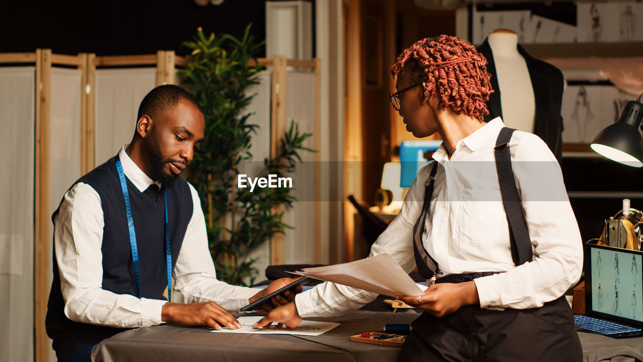 side view of business colleagues working in office