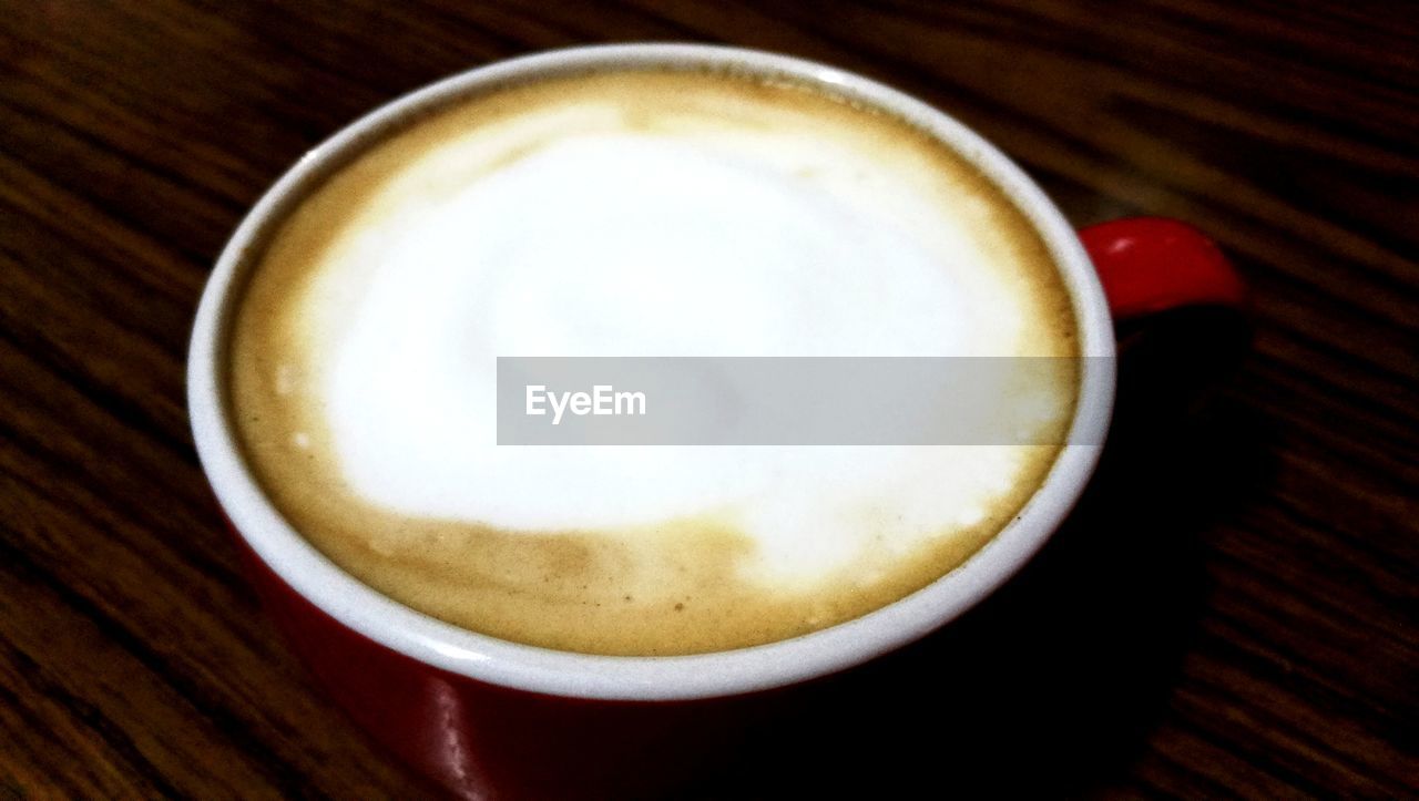 CLOSE-UP OF CAPPUCCINO ON TABLE