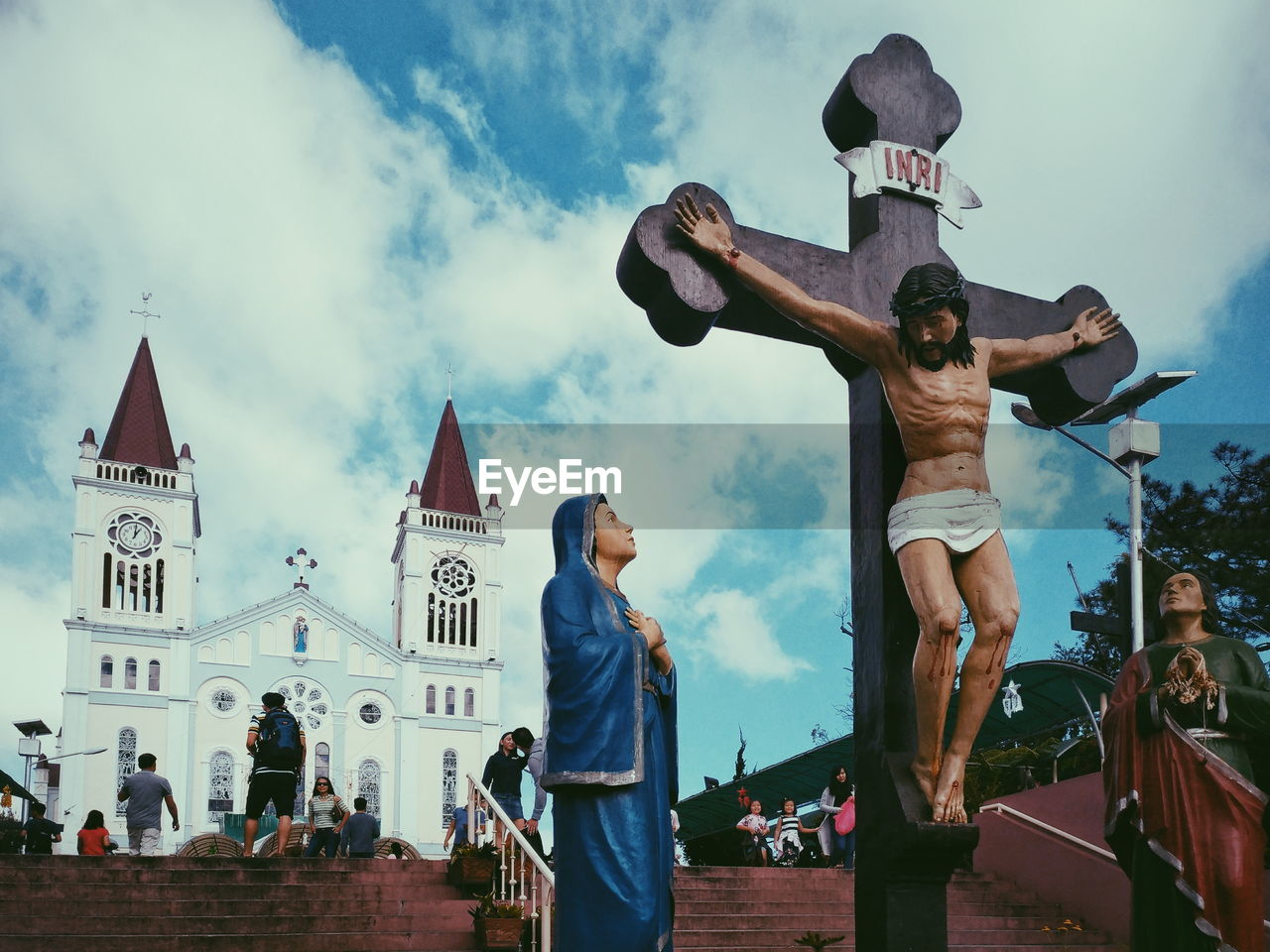 LOW ANGLE VIEW OF MEN AGAINST SKY