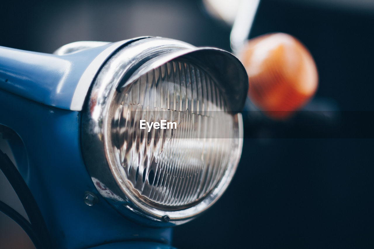 Close-up of vintage car headlight