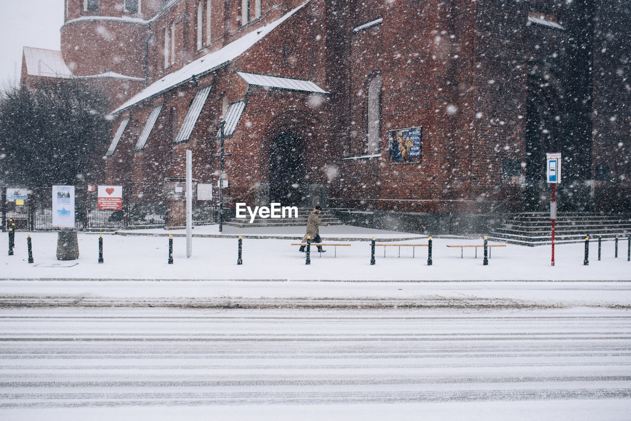 high angle view of people walking on snow