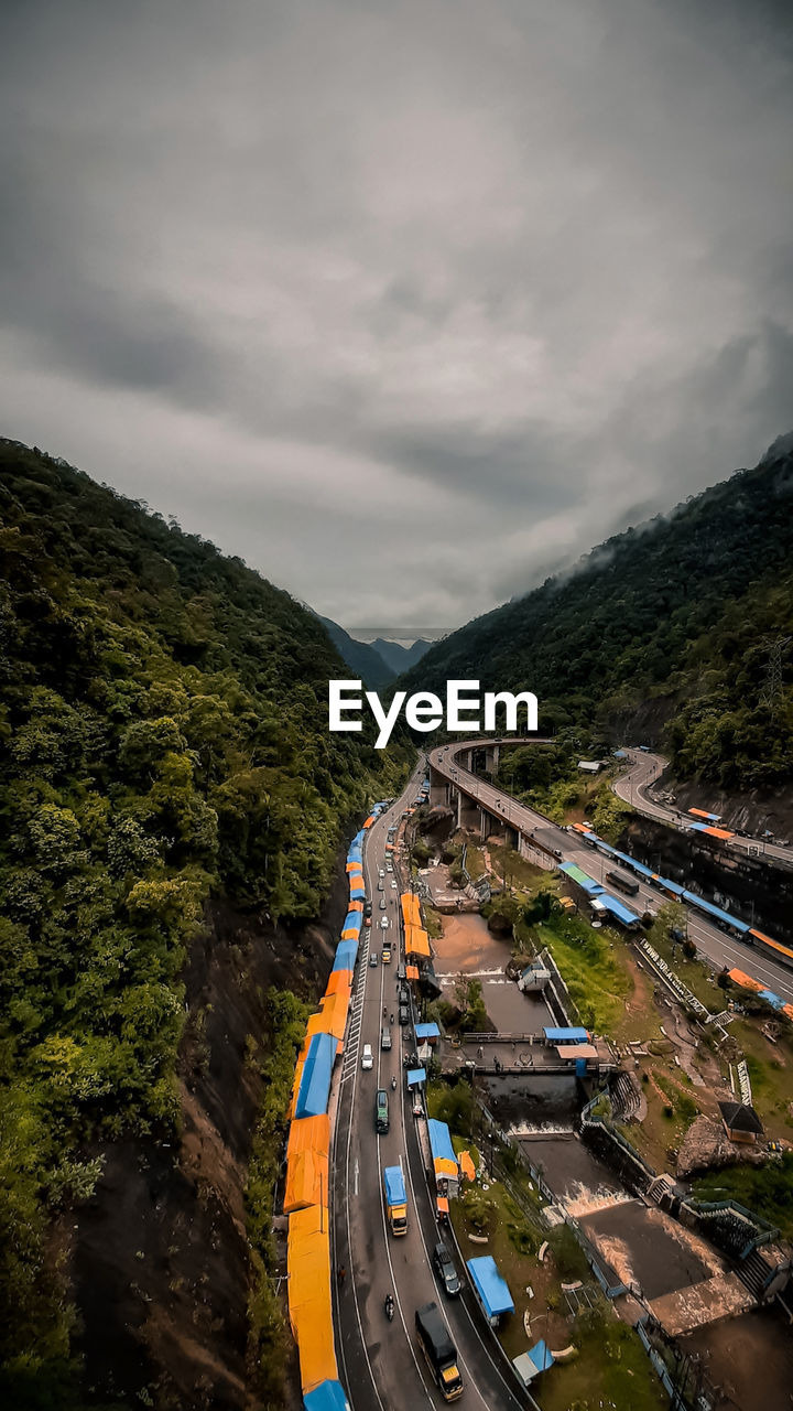 High angle view of road by mountain against sky