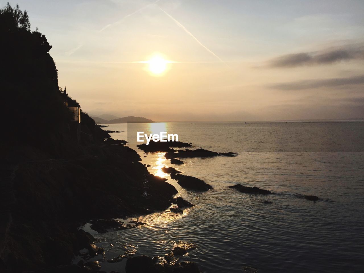 Scenic view of sea against sky at sunset