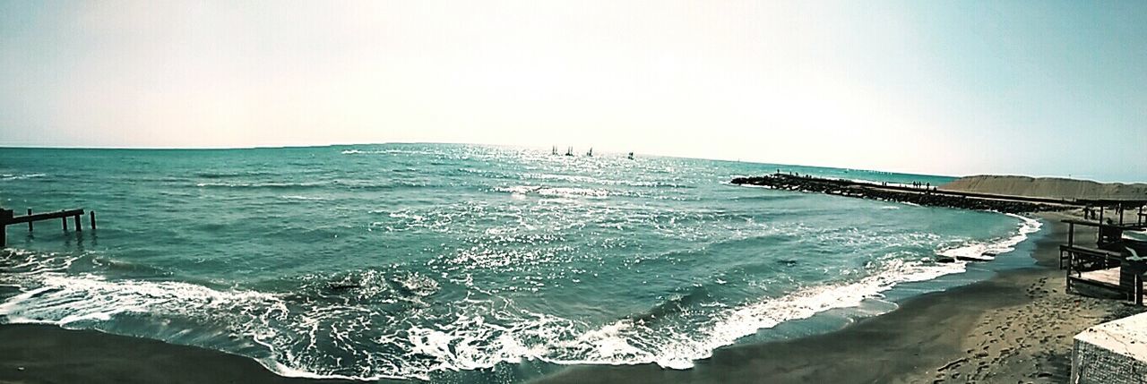 SCENIC VIEW OF SEA WITH ROCKS IN BACKGROUND